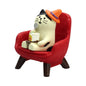 RAQWI Pig Eating Cake Figurine on Red Sofa, Mini Resin Desk Decor