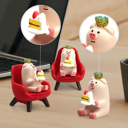 RAQWI Pig Eating Cake Figurine on Red Sofa, Mini Resin Desk Decor
